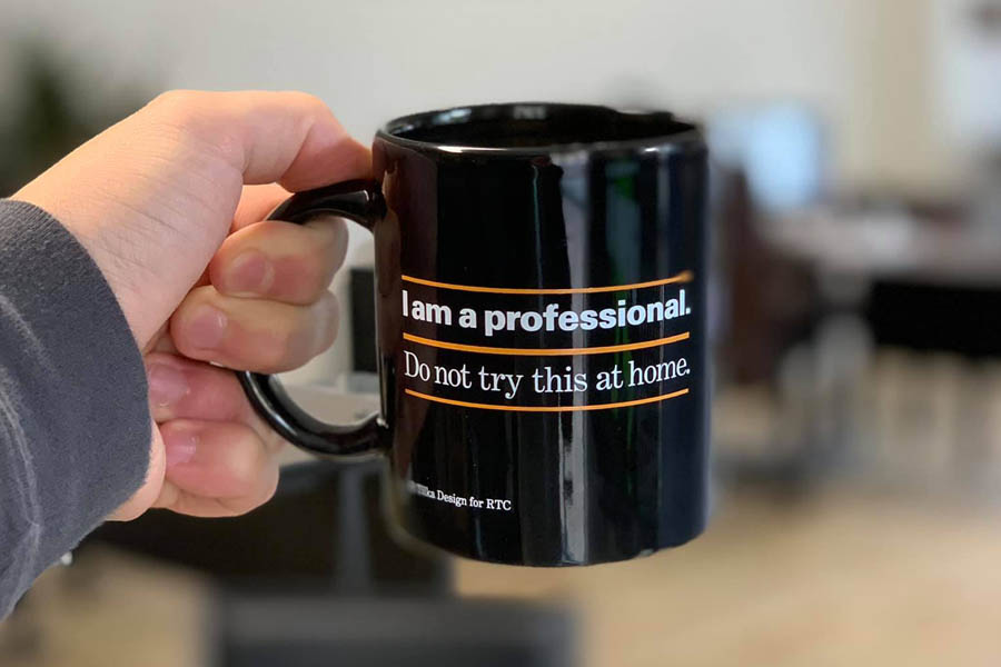 Get an Insurance Quote - Holding Up a Mug from the Office Get an Insurance Quote - Holding Up a Mug from the Office